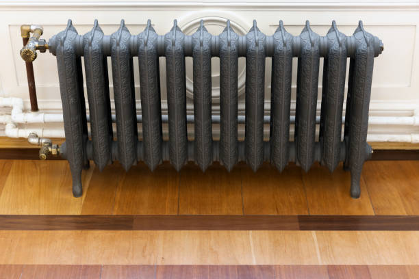 istock Wintage gray cast iron steam heating radiator, front view 1429280581