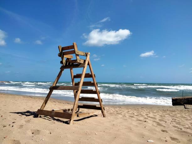 istock An isolated life guard chair at a lonely beach. 1429284021