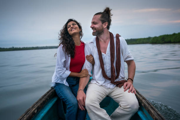 istock Couple bird watching on a river boat 1429285683