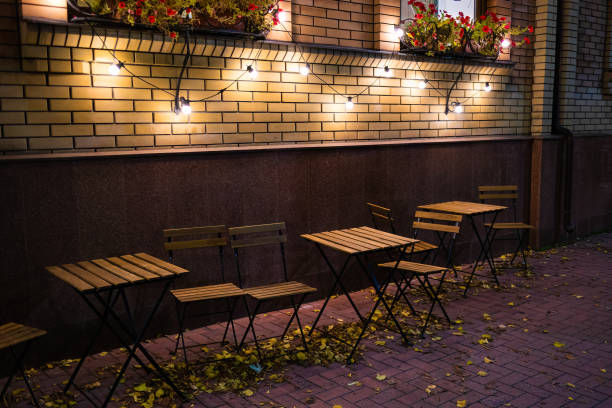istock Empty tables and chairs near the cafe on an autumn evening 1429285710