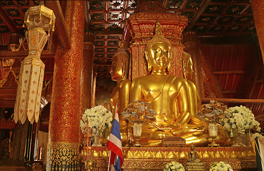 Stunning Gilded Four-sided Seated Buddha Images of Wat Phumin Temple, a Significant Buddhist Temple in Nan Province, Northern Region of Thailand