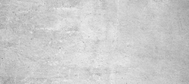 istock White gray grey bright grunge damaged scratched stone concrete cement texture wall wallpaper background panorama banner 1429290608