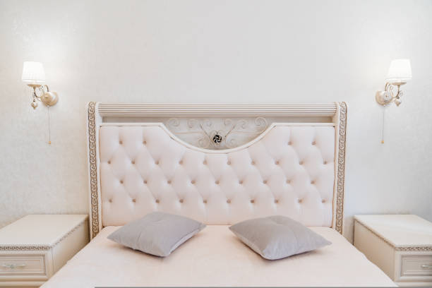 istock beautiful retro bedroom interior with a large classic bed with a soft headboard. 1429292796
