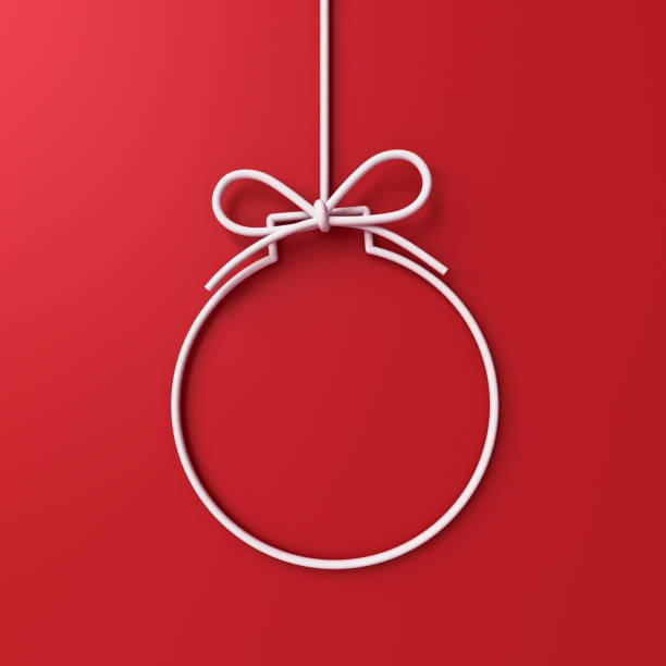 Hanging white christmas ball or bauble frame border isolated on red background with shadow minimal conceptual 3D rendering stock photo