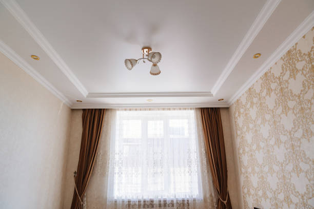 istock classic ceiling lamp with white lampshades with gold decor. 1429294892
