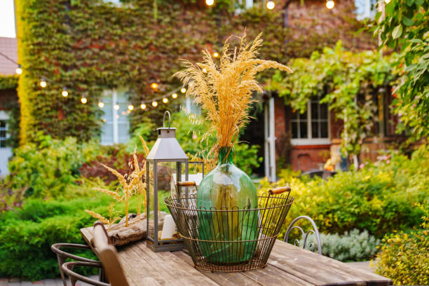 istock beautiful summer courtyard. wooden table with retro items. 1429298549