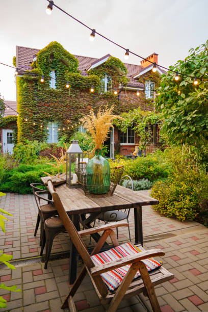 istock beautiful summer courtyard. wooden table with retro items. 1429298677