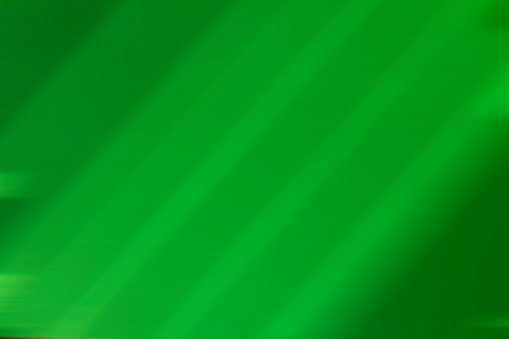 Futuristic green background with diagonal lines in blur. High quality photo