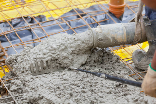 istock Pouring & Raking Concrete Foundation Building Slab 1429318604