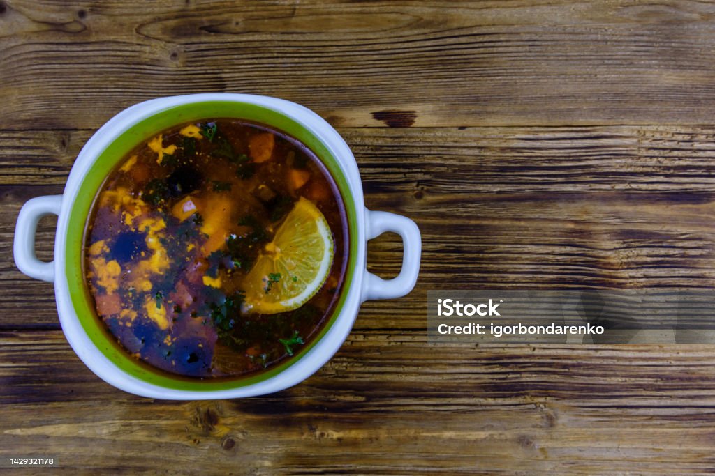 Russian traditional hodgepodge soup on a wooden table. Top view Russian traditional hodgepodge soup on wooden table. Top view Backgrounds Stock Photo