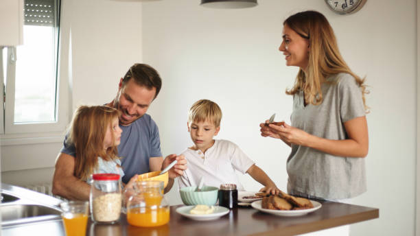 istock Parents with their kids in dining room having breakfast together 1429325609