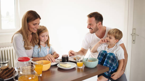 istock Parents with their kids in dining room having breakfast together 1429325626