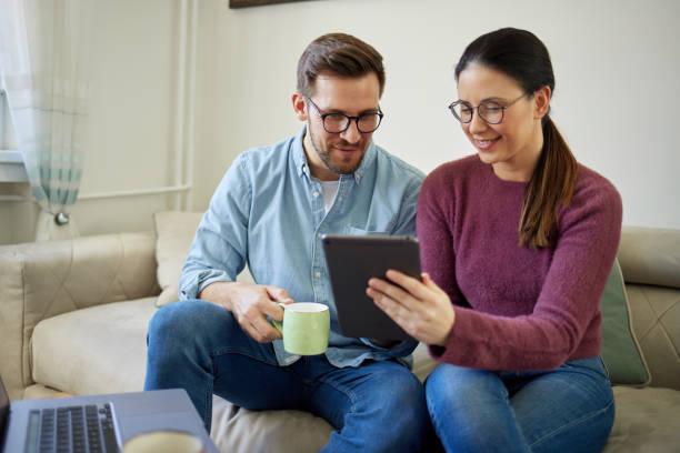 istock Checking their social media together 1429326399