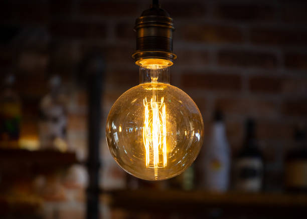 istock Light bulb with low energy filament illuminated 1429330208