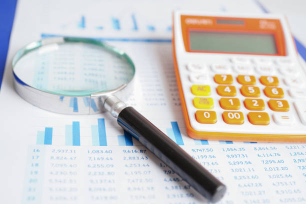 istock Magnifying glass on charts graphs paper. Financial development, Banking Account, Statistics, Investment Analytic research data economy. 1429333848