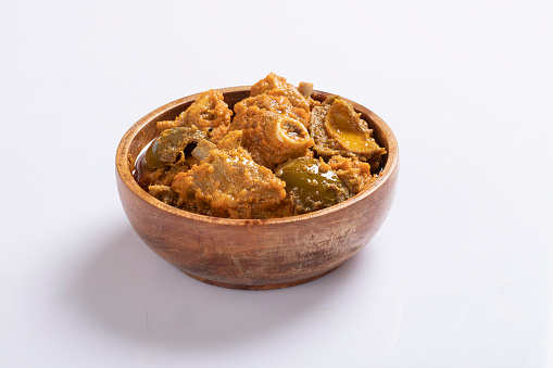 Achari mutton curry isolated on white background