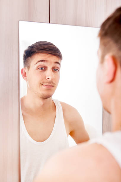 istock Young Man near the Mirror 1429337597
