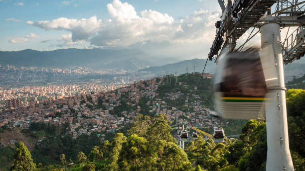 Cable Cars Traveling Over the City of Medellin, Antioquia Department, Colombia Cable cars traveling over the city of Medellin, Antioquia Department, Colombia. metro medellin stock pictures, royalty-free photos & images