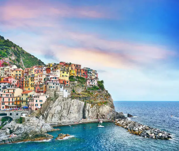 Manarola is one of the five towns that make up the Cinque Terre region in Italy. Composite photo