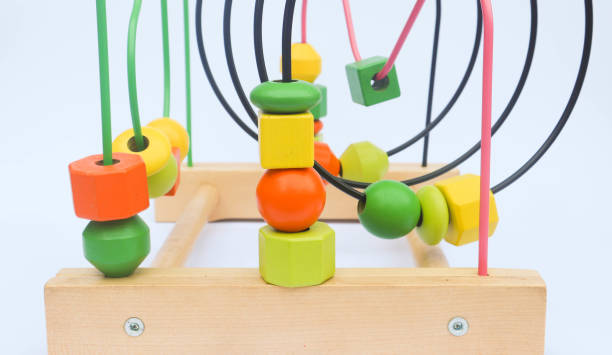 istock Colorful wooden bead roller coaster toy on white background 1429344385