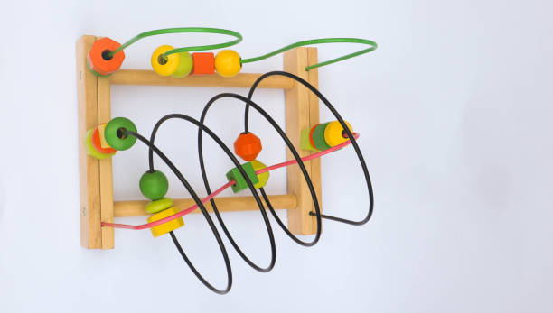 istock Colorful wooden bead roller coaster toy on white background 1429344406