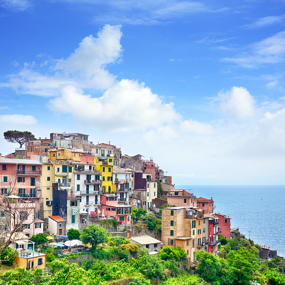 Corniglia is one of the five towns that make up the Cinque Terre region in Italy. Composite photo