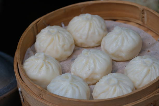 istock several white steamed buns in steamer 1429349031