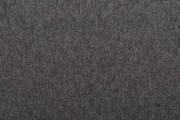 Heather grey knitted fabric textured background Dark grey melange knitted fabric made of heather mixed yarn textured background heather grey stock pictures, royalty-free photos & images