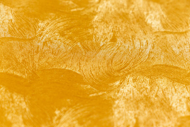 istock Golden wallpaper with fine curved pattern on the surface 1429352826
