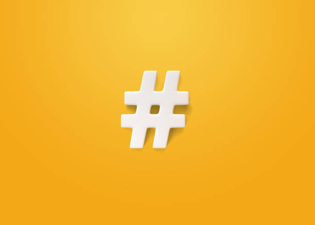 istock White hashtag symbol on a yellow background 1429369024