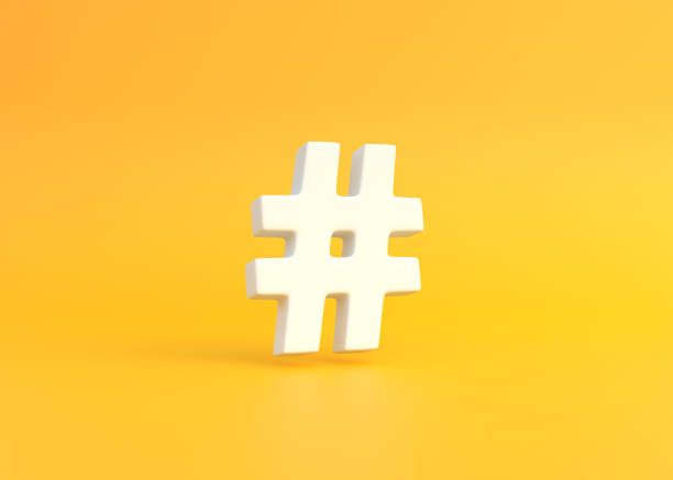 istock White hashtag symbol on a yellow background 1429369052