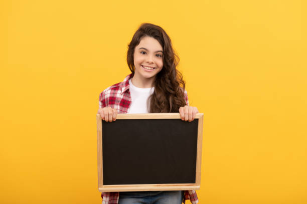 istock back to school. kid presenting novelty information. childhood education. copy space for announcement 1429372360