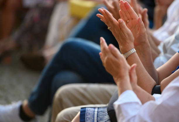 istock Audience applauding at the lecture 1429372546