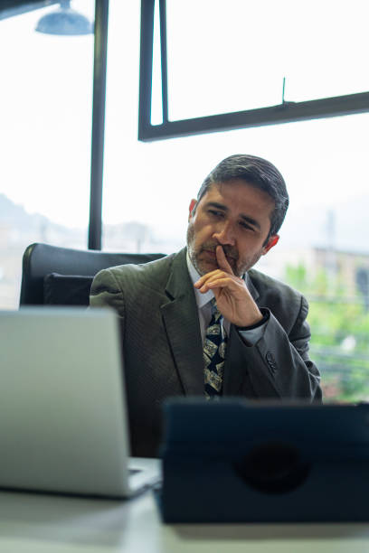 istock Businessman looks away in the office 1429374100