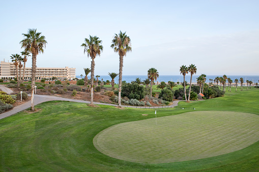 Amarilla Golf, San Miguel de Abona, Tenerife, Canary Islands, Spain - September 2, 2022: afternoon to evening mellow light over the immaculate greens and fairways at the popular coastal golf course.