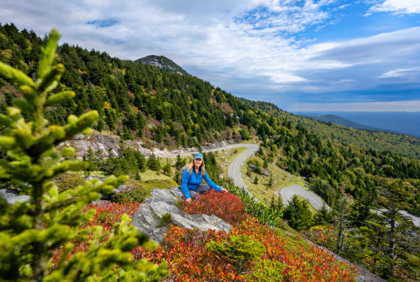 istock Smiling woman relaxing on hiking trip. 1429374427