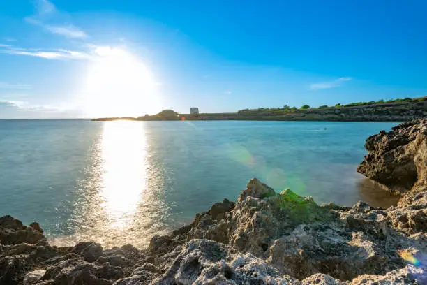 Panoramic View of the Litoral in front of Marina di Taranto, in the South of Italy at Sunset on Clear Blue Sky Background