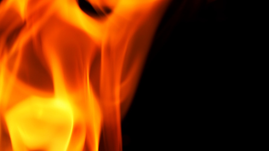 Abstract flame yellow and red and orange color on black background for represent hot or dangerous concept