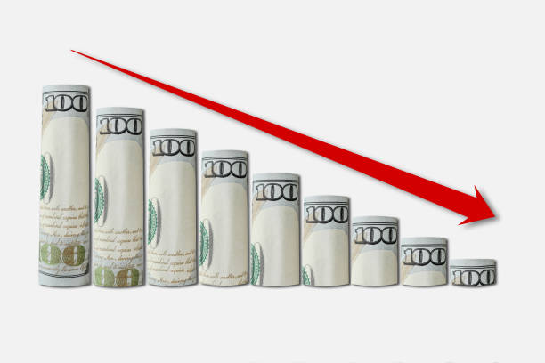 istock Rolled up dollar bills falling graph with red down arrow. Business concept, financial fall chart, analytics 1429378130