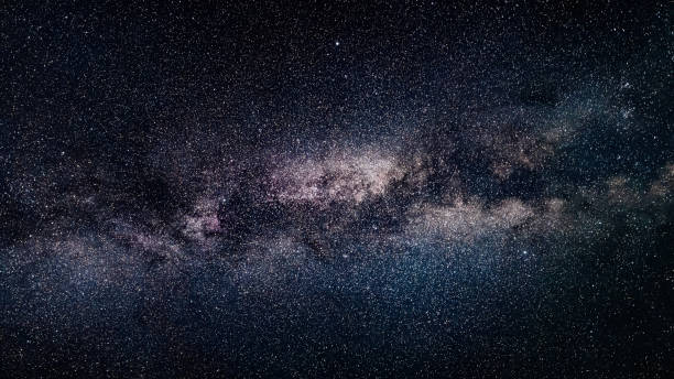 Milky Way galaxy in dark night sky stock photo