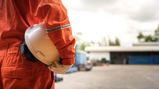 istock A worker is holding white safety helmet - Safe working practice. 1429380314