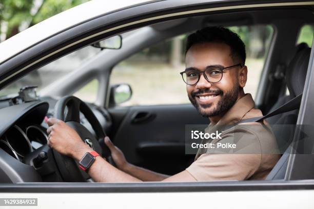 Smiling Young Man Driving A Car Stock Photo - Download Image Now - Driving, Driver - Occupation, Car