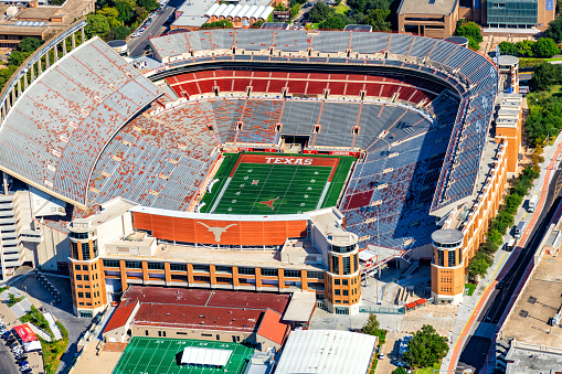 Austin, United States - September 29, 2022:  Aerial view of the Darrell K. Royal - Texas Memorial Stadium on the campus of the University of Texas at Austin which seats over 100,000 and is the home of the Texas Longhorns.  The stadium is a publicly constructed and maintained facility on the campus of this public university.