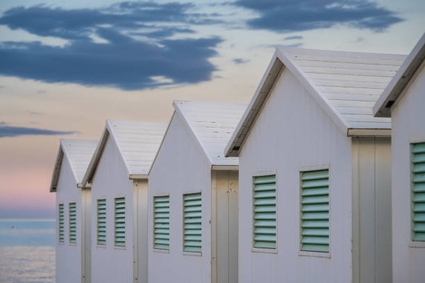 White Beach Huts at the Lido di Venezia in Venice, Italy at Dusk in the Evening