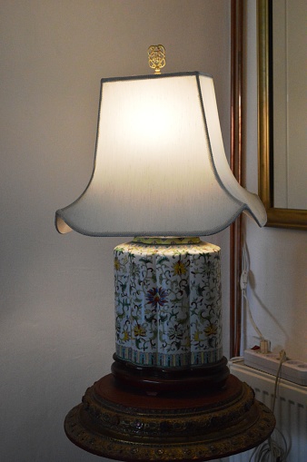 an old lamp with a large white shade
