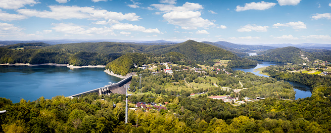 Vacations in Poland - Lake Solina with water dam and overhedd cable car, Bieszczady Mountains in background