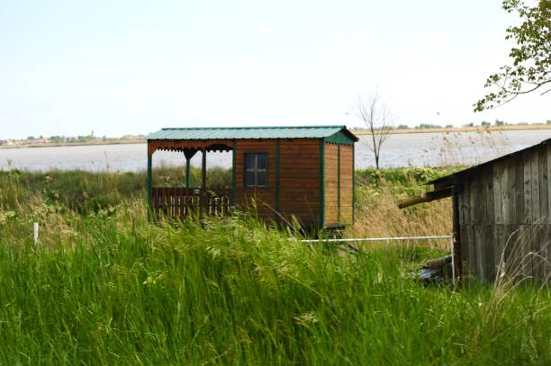 istock a small wooden house by the river 1429398272