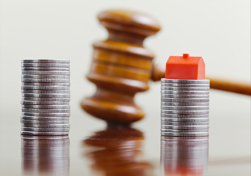 Division of Assets in Divorce of Money and House with a Judges Gavel