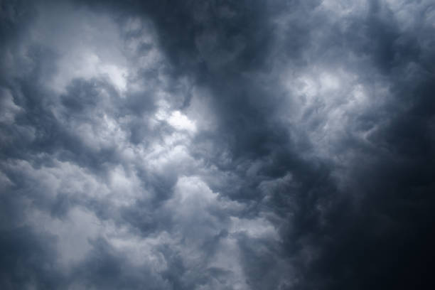 istock Dark thunderstorm clouds and clouds shining due to light grey color horizontal image 1429410410