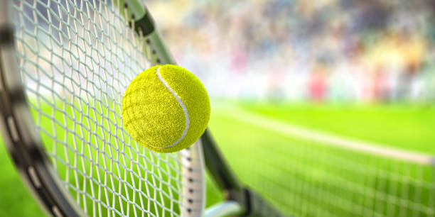Tennis racket and ball on tennis court. stock photo